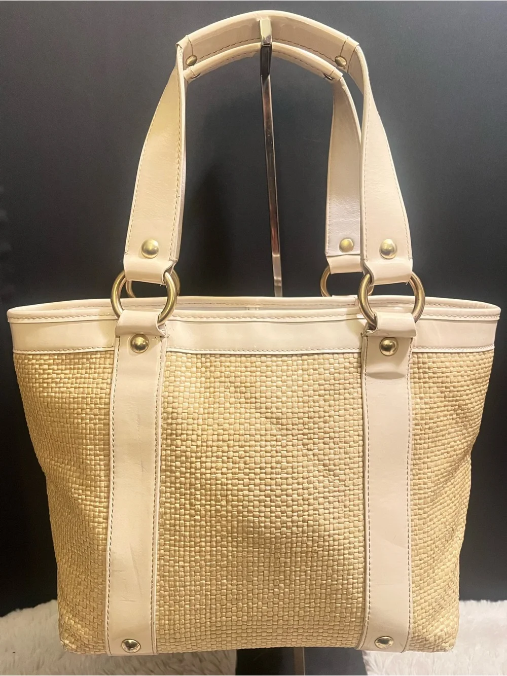 Coach white leather and straw tote.